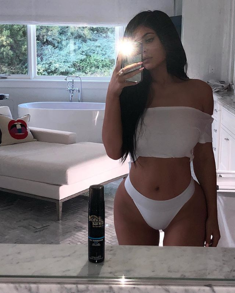 Kylie Jenner in white swimsuit bottom from Frankies Bikinis