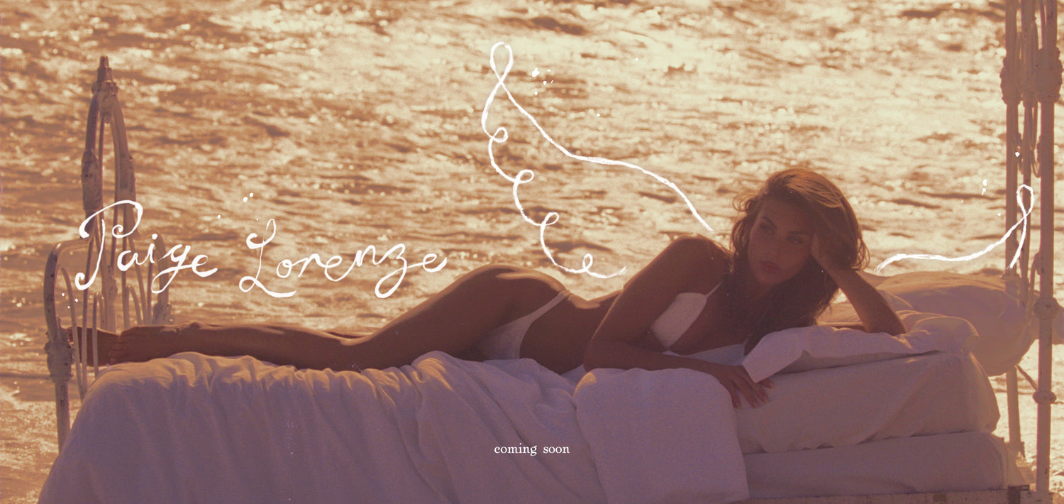 Woman lying on a boat with sunset and water in the background, featuring the name 'Paige Lorenzo'.