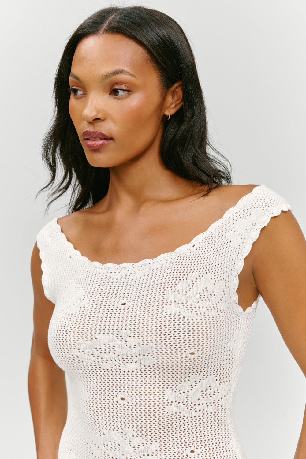 white crochet mini dress Lovely - Dress This white mini dress features an open crochet knit construction with contrast scalloped trim in orange and lilac Montego Mini Dress - Ivory